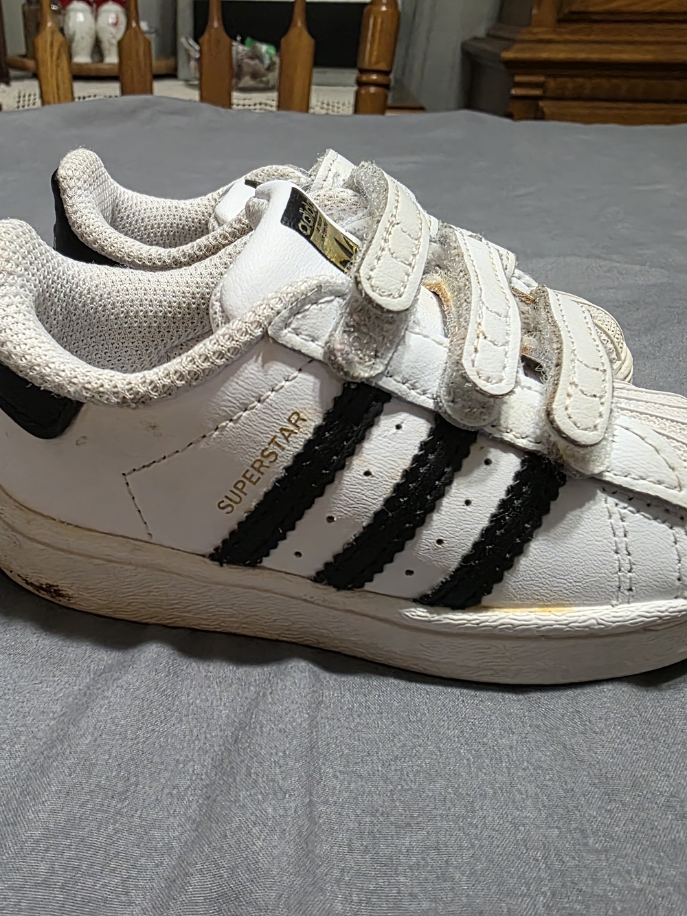 adidas Kids White Sneakers with Black Stripes and Gold Accent